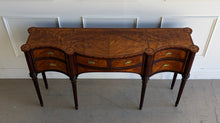 Load image into Gallery viewer, Top down angled view of the Theodore Alexander Stanhope Row Sideboard highlighting the morado crossbanded top, figured flame mahogany veneer, and sculptural serpentine profile, available at Good Bones Furniture in Raleigh, NC.
