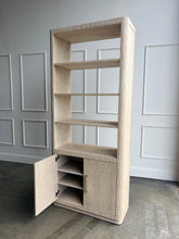 Load image into Gallery viewer, The Horizon Etagere by Theodore Alexander combines generous display space with a light, contemporary silhouette. Crafted from oak in a pale Day finish, its softly rounded frame and finely reeded details introduce texture while preserving the collection’s clean lines. Multiple open shelves provide ample room for books, art, and collected objects, while the two-door cabinet below offers convenient concealed storage. Good Bones Furniture
