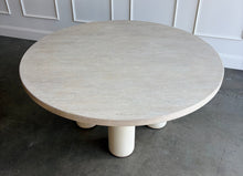 Load image into Gallery viewer, The Maxwell Round Dining Table by Theodore Alexander combines natural oak grain with distinctive shagreen texture and an architectural silhouette. Crafted from oak wood and oak veneers, the generous round top is finished in pale Cashmere, allowing its organic grain to remain visible. Four cylindrical supports feature a subtle shagreen surface in a tonal Dove finish. Good Bones Furniture
