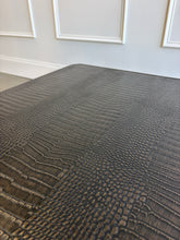 Load image into Gallery viewer, The Spencer St. James Square Cocktail Table by Theodore Alexander combines bold contemporary form with richly tactile materials. Crafted from oak wood and crocodile-embossed leather, its substantial square silhouette features clipped corners that soften the strong architectural lines. Good Bones Furniture
