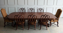 Load image into Gallery viewer, Thomasville Ernest Hemingway Collection 9-piece dining set. Designed with classic European influences and the relaxed sophistication that defines the Ernest Hemingway Collection, this complete dining suite features a beautifully figured mahogany extension table paired with six sculptural loop-back side chairs and two generously proportioned host armchairs. Good Bones Furniture

