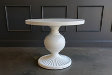 Load image into Gallery viewer, The Marco Center Table from Tommy Bahama’s Ocean Breeze collection pairs a clean round top with a sculptural pedestal base. Its urn-shaped center and radiating fluted base give the table graceful architectural detail while maintaining a relaxed, versatile appearance. Professionally lacquered in the color of your choice by Good Bones Furniture.

