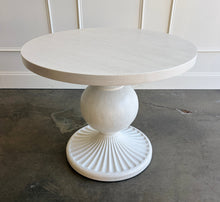 Load image into Gallery viewer, The Marco Center Table from Tommy Bahama’s Ocean Breeze collection pairs a clean round top with a sculptural pedestal base. Its urn-shaped center and radiating fluted base give the table graceful architectural detail while maintaining a relaxed, versatile appearance. Professionally lacquered in the color of your choice by Good Bones Furniture.
