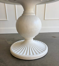 Load image into Gallery viewer, The Marco Center Table from Tommy Bahama’s Ocean Breeze collection pairs a clean round top with a sculptural pedestal base. Its urn-shaped center and radiating fluted base give the table graceful architectural detail while maintaining a relaxed, versatile appearance. Professionally lacquered in the color of your choice by Good Bones Furniture.
