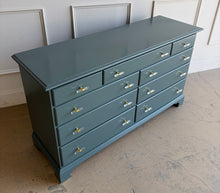 Load image into Gallery viewer, This vintage solid wood 9-drawer dresser has been professionally lacquered in Farrow &amp; Ball Inchyra Blue, a refined blue-green tone that brings depth and understated drama to any room. The clean, traditional lines pair beautifully with new lucite and brass handles, creating a balanced look that feels both classic and freshly updated. Each drawer offers generous storage, making this a functional statement piece for bedrooms, entryways, or living spaces. Good Bones Furniture
