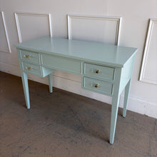 Load image into Gallery viewer, This vintage Craftique vanity has been professionally refinished in a custom light teal lacquer, giving the classic form a fresh, tailored look. Clean lines and tapered legs reflect the refined simplicity Craftique furniture is known for, while new lucite and brass hardware adds a subtle touch of modern glamour. Good Bones Furniture
