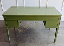 Load image into Gallery viewer, Vintage desk by Drexel Furniture combines practical workspace with timeless architectural detailing. Professionally lacquered in Farrow &amp; Ball Bancha, its earthy olive-green finish highlights the framed drawer fronts, inset desktop border, and slender tapered legs. Four drawers, original polished brass hardware and brass-capped feet. Good Bones Furniture
