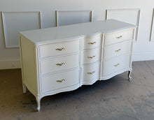 Load image into Gallery viewer, Elegant curves, classic proportions, and the kind of quality Drexel is known for make this vintage French dresser an easy choice for a custom lacquer finish. With nine drawers and a beautifully shaped front, it offers generous storage while keeping a light, refined silhouette. The cabriole-style legs and subtle molded details give it that timeless French character. Good Bones Furniture
