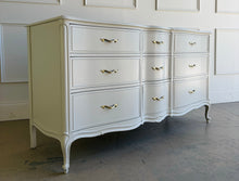 Load image into Gallery viewer, Elegant curves, classic proportions, and the kind of quality Drexel is known for make this vintage French dresser an easy choice for a custom lacquer finish. With nine drawers and a beautifully shaped front, it offers generous storage while keeping a light, refined silhouette. The cabriole-style legs and subtle molded details give it that timeless French character. Good Bones Furniture
