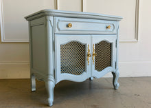 Load image into Gallery viewer, Professionally lacquered in Farrow &amp; Ball Parma Gray, this pair of vintage French nightstands blends classic European styling with a softer, more modern palette. The elegant cabriole legs, shaped apron, and bombe-inspired silhouette give the pieces timeless character, while the muted blue-gray lacquer creates a fresh, elevated look suited for both traditional and contemporary interiors. Good Bones Furniture
