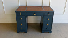 Load image into Gallery viewer, This vintage desk has been professionally lacquered in Farrow &amp; Ball Hague Blue, giving the classic form a rich, tailored presence. The leather inset top adds warmth and contrast, while new brass knobs provide a refined finishing touch. Good Bones Furniture

