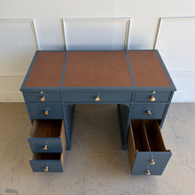 Load image into Gallery viewer, This vintage desk has been professionally lacquered in Farrow &amp; Ball Hague Blue, giving the classic form a rich, tailored presence. The leather inset top adds warmth and contrast, while new brass knobs provide a refined finishing touch. Good Bones Furniture
