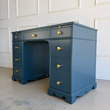 Load image into Gallery viewer, This vintage desk has been professionally lacquered in Farrow &amp; Ball Hague Blue, giving the classic form a rich, tailored presence. The leather inset top adds warmth and contrast, while new brass knobs provide a refined finishing touch. Good Bones Furniture
