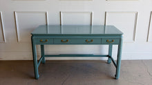 Load image into Gallery viewer, This vintage Lane Furniture writing desk features a restrained Asian-inspired silhouette with softly rounded corners, inset panel detailing, and sculptural legs connected by low stretchers that give the piece a grounded, furniture-quality presence. Custom lacquered teal. Good Bones Furniture
