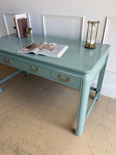 Load image into Gallery viewer, This vintage Lane Furniture writing desk features a restrained Asian-inspired silhouette with softly rounded corners, inset panel detailing, and sculptural legs connected by low stretchers that give the piece a grounded, furniture-quality presence. Custom lacquered teal. Good Bones Furniture
