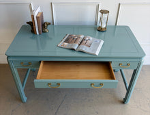 Load image into Gallery viewer, This vintage Lane Furniture writing desk features a restrained Asian-inspired silhouette with softly rounded corners, inset panel detailing, and sculptural legs connected by low stretchers that give the piece a grounded, furniture-quality presence. Custom lacquered teal. Good Bones Furniture

