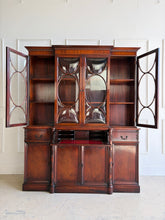 Load image into Gallery viewer, This vintage mahogany china cabinet is a striking storage and display piece defined by its distinctive bubble glass doors and substantial scale. The upper cabinet offers beautiful display space for china, glassware, books, or collected objects, while the lower section provides generous concealed storage to keep a room feeling organized and polished. Good Bones Furniture
