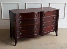 Load image into Gallery viewer, Graceful curves and timeless craftsmanship define this vintage mahogany dresser. Featuring a distinctive serpentine front with eight spacious drawers, this piece offers elegant proportions and exceptional storage while maintaining a refined footprint. Traditional bracket feet, classic oval brass hardware, and rich mahogany construction give the dresser a sophisticated presence that works beautifully in both traditional and transitional interiors. Good Bones Furniture
