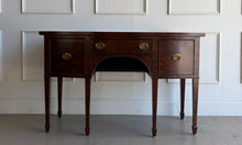 Load image into Gallery viewer, This vintage Maitland-Smith sideboard showcases the brand’s renowned craftsmanship and elegant neoclassical styling. Crafted with richly figured mahogany veneers, the serpentine front and graceful arched apron create a sophisticated silhouette, while brass lion-head hardware and tapered inlaid legs add refined details throughout. Good Bones Furniture
