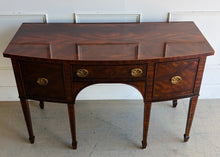 Load image into Gallery viewer, This vintage Maitland-Smith sideboard showcases the brand’s renowned craftsmanship and elegant neoclassical styling. Crafted with richly figured mahogany veneers, the serpentine front and graceful arched apron create a sophisticated silhouette, while brass lion-head hardware and tapered inlaid legs add refined details throughout. Good Bones Furniture
