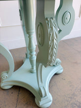 Load image into Gallery viewer, restored vintage foyer table. Professionally refinished in a custom mint green lacquer, this charming octagonal accent table pairs graceful neoclassical styling with a crisp contemporary finish. The sculptural pedestal base features scrolling supports, carved acanthus leaf details, and turned center elements that create visual interest from every angle. Good Bones Furniture

