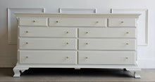 Load image into Gallery viewer, This vintage dresser by National Mt. Airy combines traditional craftsmanship with a fresh, updated finish. The silhouette is classic and balanced, with softly shaped feet, subtle crown molding, and clean paneled drawer fronts that give the piece a tailored, timeless presence. Professionally lacquered in a custom greige, the finish brings a versatile neutral tone that feels warm, refined, and easy to place in a range of interiors. Good Bones Furniture

