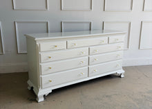 Load image into Gallery viewer, This vintage dresser by National Mt. Airy combines traditional craftsmanship with a fresh, updated finish. The silhouette is classic and balanced, with softly shaped feet, subtle crown molding, and clean paneled drawer fronts that give the piece a tailored, timeless presence. Professionally lacquered in a custom greige, the finish brings a versatile neutral tone that feels warm, refined, and easy to place in a range of interiors. Good Bones Furniture

