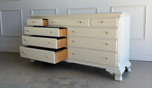 Load image into Gallery viewer, This vintage dresser by National Mt. Airy combines traditional craftsmanship with a fresh, updated finish. The silhouette is classic and balanced, with softly shaped feet, subtle crown molding, and clean paneled drawer fronts that give the piece a tailored, timeless presence. Professionally lacquered in a custom greige, the finish brings a versatile neutral tone that feels warm, refined, and easy to place in a range of interiors. Good Bones Furniture
