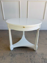 Load image into Gallery viewer, This vintage Heritage round end table pairs classic lines with a fresh lacquered finish in Benjamin Moore White Dove. The crisp white surface gives the piece a clean, updated look, while the sculptural base and curved stretchers preserve its traditional character. Good Bones Furniture
