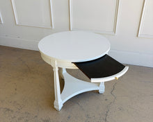 Load image into Gallery viewer, This vintage Heritage round end table pairs classic lines with a fresh lacquered finish in Benjamin Moore White Dove. The crisp white surface gives the piece a clean, updated look, while the sculptural base and curved stretchers preserve its traditional character. Good Bones Furniture
