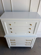 Load image into Gallery viewer, This vintage Thomasville chest on chest provides generous storage within a tall, space-conscious silhouette. Professionally lacquered in Benjamin Moore White Dove, its softly warm off-white finish has subtle creamy undertones that feel bright without appearing stark. Six spacious drawers are arranged across two architecturally framed sections, creating the appearance of stacked chests. New brass knobs and linear pulls. Good Bones Furniture
