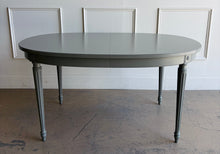 Load image into Gallery viewer, This vintage Thomasville dining table features a clean oval silhouette, tapered fluted legs, and understated neoclassical detailing that gives it a tailored, architectural presence without feeling overly formal. Custom lacquered in Lauriston Stone. Good Bones Furniture

