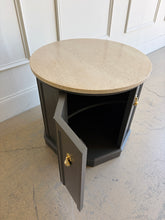 Load image into Gallery viewer, This vintage end table has been professionally refinished in Sherwin-Williams Urbane Bronze, creating a sophisticated contrast against its natural travertine stone top. The rich charcoal finish highlights the table's distinctive faceted silhouette while allowing the warm tones and organic texture of the travertine to take center stage. Good Bones Furniture
