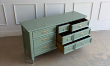 Load image into Gallery viewer, This vintage seven drawer dresser by White Furniture Co. showcases the exceptional craftsmanship and timeless proportions that made the North Carolina manufacturer one of America's most respected furniture makers. Professionally lacquered in custom light green, this piece can complement everything from traditional interiors to today's transitional and modern homes. Good Bones Furniture
