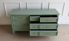 Load image into Gallery viewer, This vintage seven drawer dresser by White Furniture Co. showcases the exceptional craftsmanship and timeless proportions that made the North Carolina manufacturer one of America's most respected furniture makers. Professionally lacquered in custom light green, this piece can complement everything from traditional interiors to today's transitional and modern homes. Good Bones Furniture
