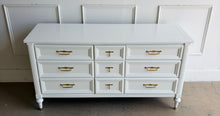 Load image into Gallery viewer, This vintage seven drawer dresser by White Furniture Co. showcases the exceptional craftsmanship and timeless proportions that made the North Carolina manufacturer one of America's most respected furniture makers. Professionally lacquered in White Dove by Benjamin Moore, this piece can complement everything from traditional interiors to today's transitional and modern homes. Good Bones Furniture
