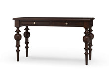Load image into Gallery viewer, Front view of the Vivienne Desk in Teak brown finish by Bramble, a mahogany writing desk with sculptural turned legs and two drawers, crafted in Indonesia and offered by Good Bones Furniture to customers across the United States.

