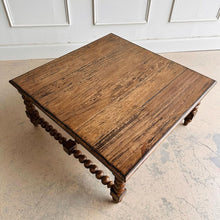 Load image into Gallery viewer, The Wellmington Coffee Table is a beautiful statement piece that brings both character and functionality to any living space. Crafted from solid Mango wood, it features stunning large bobbin legs and cross braces that highlight its traditional craftsmanship. The substantial square design ensures ample surface area, making it perfect for both decorative displays and everyday use. Good Bones Furniture
