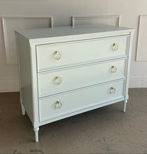 Load image into Gallery viewer, Detail view of the Boylan 3-drawer chest with a smooth lacquered finish, highlighting craftsmanship, drawer construction, and brass hardware by Good Bones Furniture in Raleigh, NC
