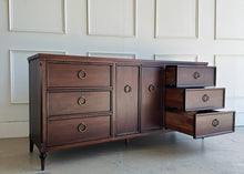 Load image into Gallery viewer, Boylan 9 drawer credenza dresser with right-side drawers extended, revealing lacquered interiors and soft-close undermount slides.
