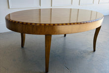 Load image into Gallery viewer, Lillian August oval coffee table showroom sample with rich wood finish, inlay trim detail, and classic tapered legs in excellent structural condition.

