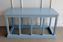 Load image into Gallery viewer, Straight-on view of a neoclassical console table in Parma Gray, photographed from above to highlight its lacquered top and architectural detailing.
