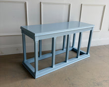 Load image into Gallery viewer, Angled right view of a neoclassical console table in Parma Gray, highlighting the fluted legs, plinth base, and crisp classical lines.
