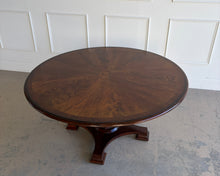 Load image into Gallery viewer, Top angled view of a vintage Stanley Furniture Co. 60-inch round dining table showing the sunburst veneer top and the upper portion of the sculptural pedestal base.
