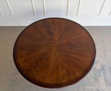 Load image into Gallery viewer, Overhead view of the Stanley Furniture Co. round dining table showcasing the radiating sunburst veneer pattern and natural wood grain.
