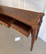 Load image into Gallery viewer, Angled right view of the Theodore Alexander Grandinson Console highlighting turned legs, drawer detail, and warm mahogany finish with inlaid top.
