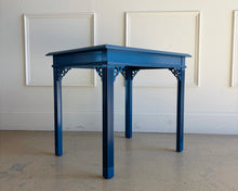 Load image into Gallery viewer, Side view of vintage lacquered bedside table in deep navy blue, showcasing sleek finish, square top, and elegant fluted legs for bedroom or living room use.
