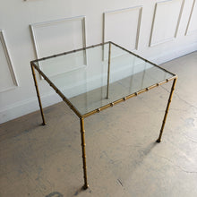 Load image into Gallery viewer, Woodbridge Lacoste game table featuring a square 3/8 inch tempered glass top inset within a brass faux bamboo frame, inspired by 19th-century English Regency design.
