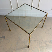 Load image into Gallery viewer, Top view of Woodbridge Lacoste brass game table with inset tempered glass surface and faux bamboo detailing, like-new showroom sample in excellent condition.
